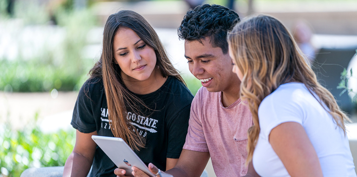 Three students sitting together