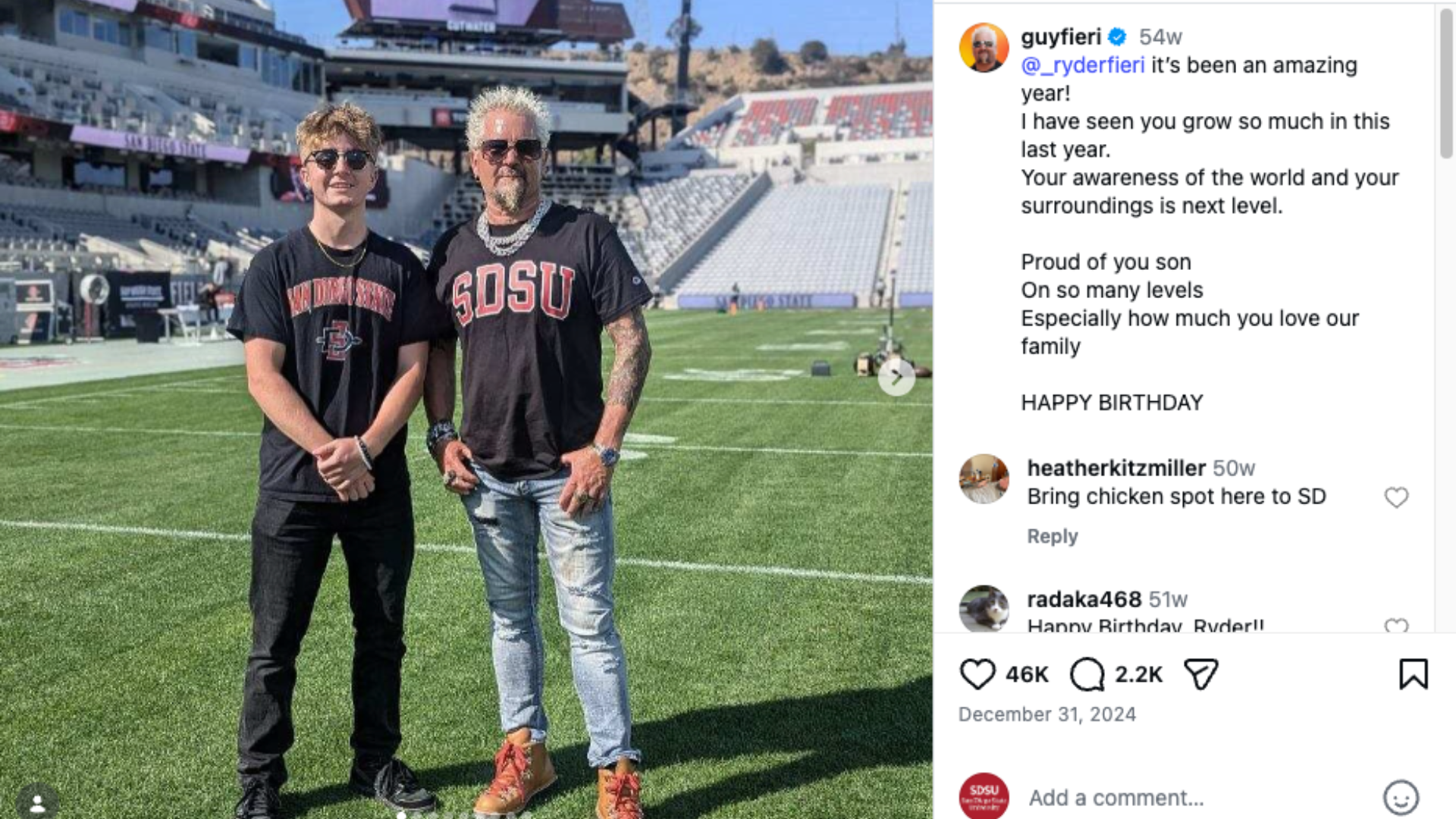 2 people posing for a picture at a stadium
