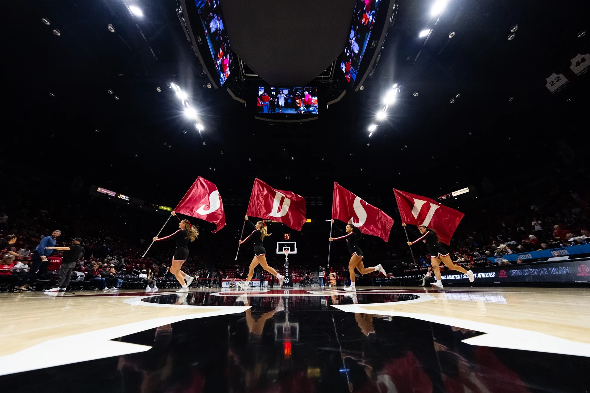 SDSU Spelled out in flags by 4 people